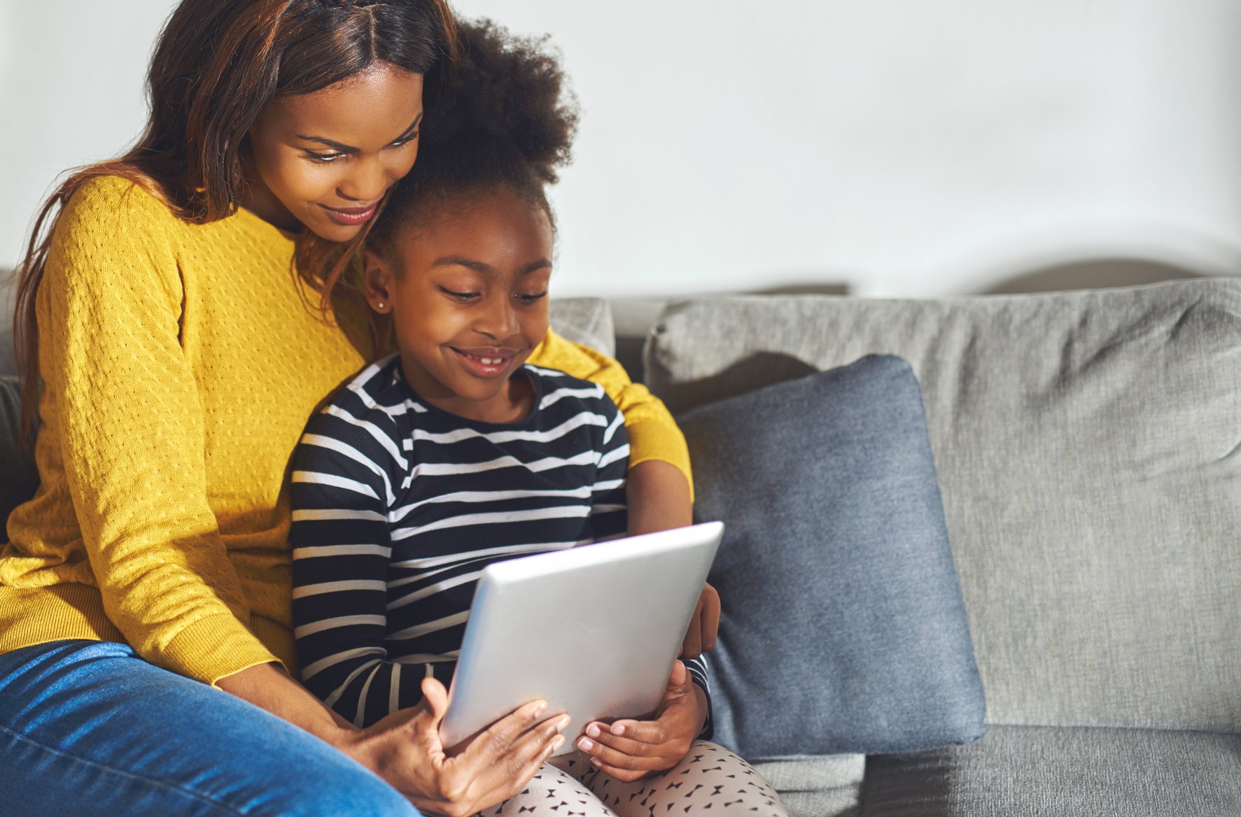 Black Mom and Child with Tablet